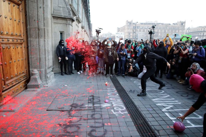 People take part in a protest against gender-based violence in downtown of Mexico City