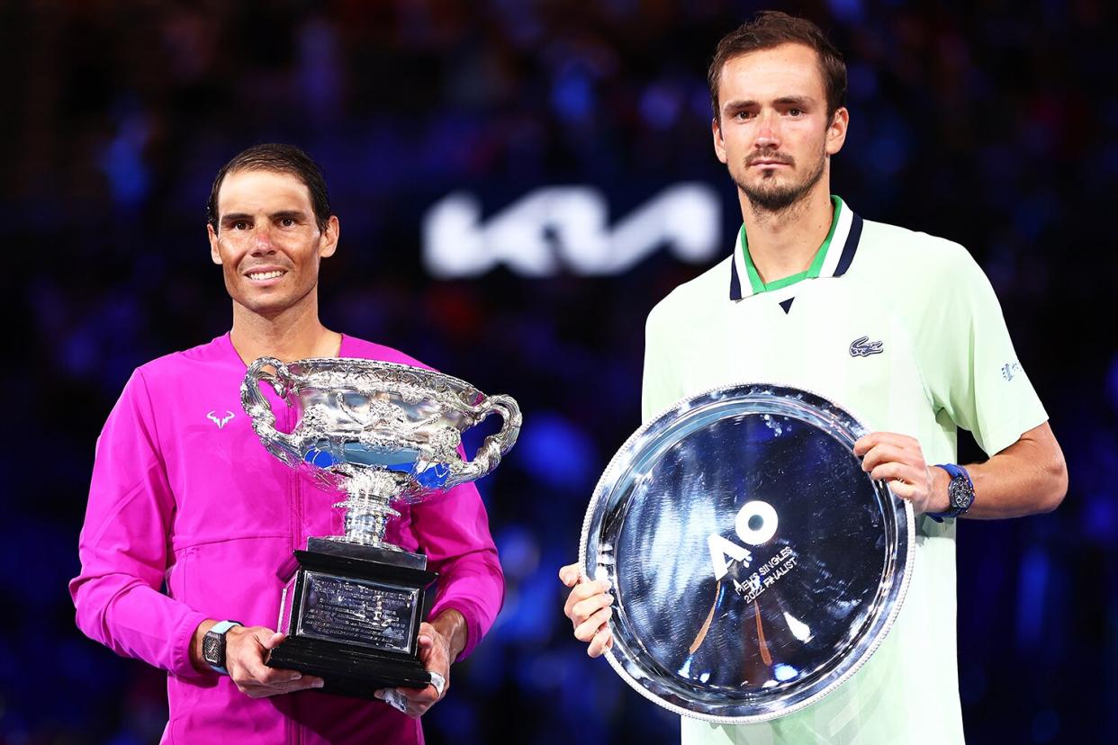 Rafael Nadal (L) of Spain and Daniil Medvedev of Russia pose during the trophy presentation for the Men’s Singles Final match during day 14 of the 2022 Australian Open at Melbourne Park on January 30, 2022 in Melbourne, Australia.
