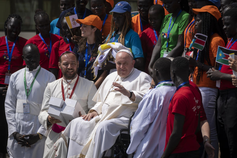 Pope Francis meets with a group of the Catholic faithful from the town of Rumbek, who had walked for more than a week to reach the capital, after he addressed clergy at the St. Theresa Cathedral in Juba, South Sudan Saturday, Feb. 4, 2023. Pope Francis is in South Sudan on the second leg of a six-day trip that started in Congo, hoping to bring comfort and encouragement to two countries that have been riven by poverty, conflicts and what he calls a "colonialist mentality" that has exploited Africa for centuries. (AP Photo/Ben Curtis)