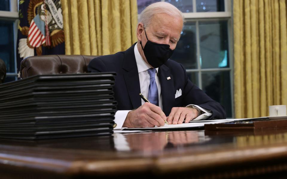 Biden signs his first executive orders as President - GETTY IMAGES
