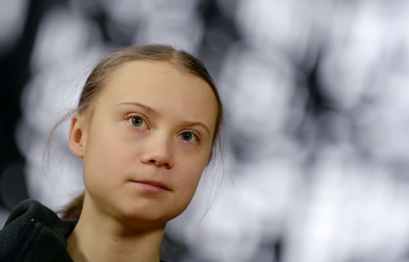 FILE PHOTO: Swedish climate activist Greta Thunberg talks to the media before meeting with EU environment ministers in Brussels