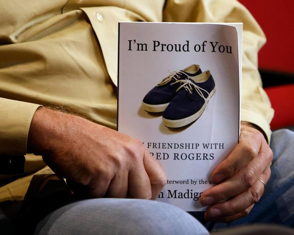 Former Star-Telegram reporter Tim Madigan holds a copy of his 2012 bestseller ‘I’m Prod of You: My Friendship With Mr. Rogers.”
