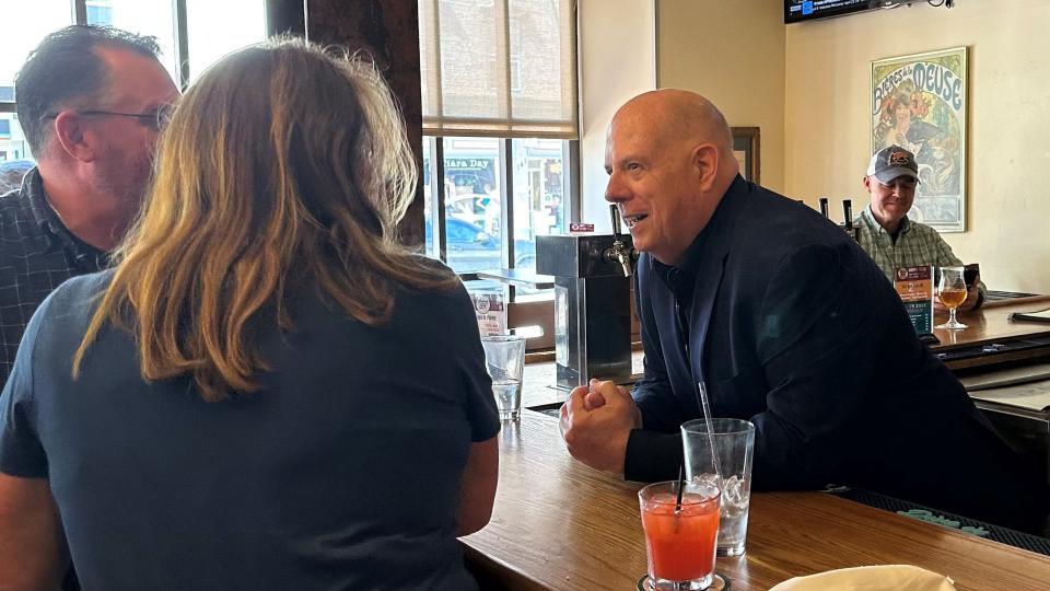 Former Maryland Gov. Larry Hogan, a Republican candidate for Senate, speaks to patrons at a pub in Frederick, Maryland, on April 6, 2024.