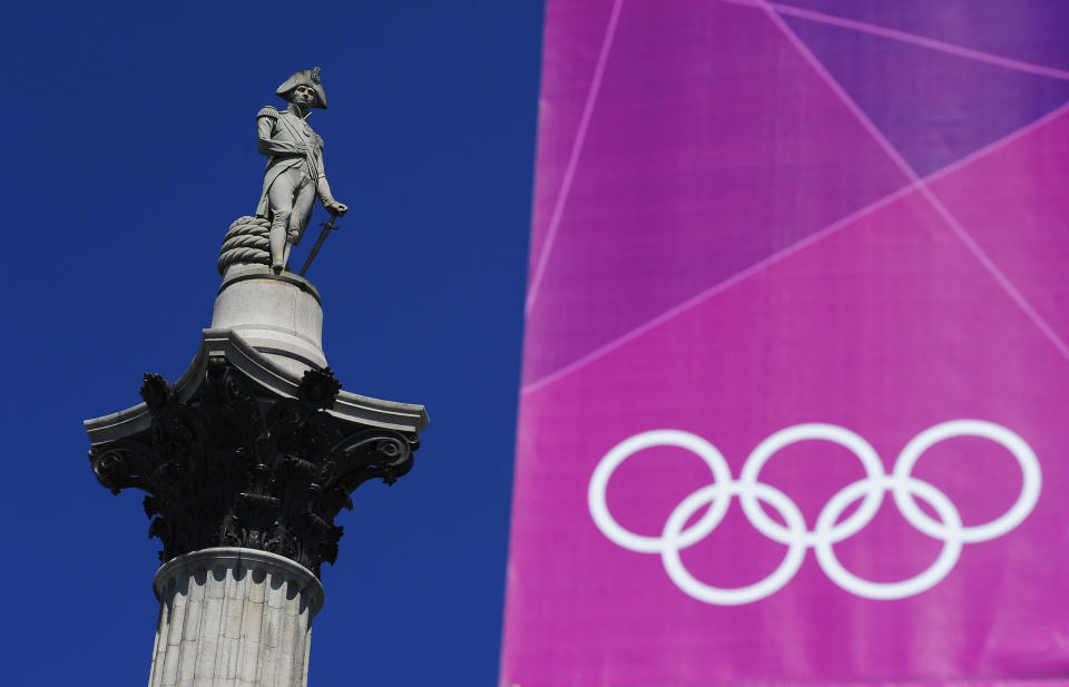 The Olympic rings hang in front of Nelson's Column in Trafalgar Square on July 23, 2012 in London, England. (Photo by Mike Hewitt/Getty Images)