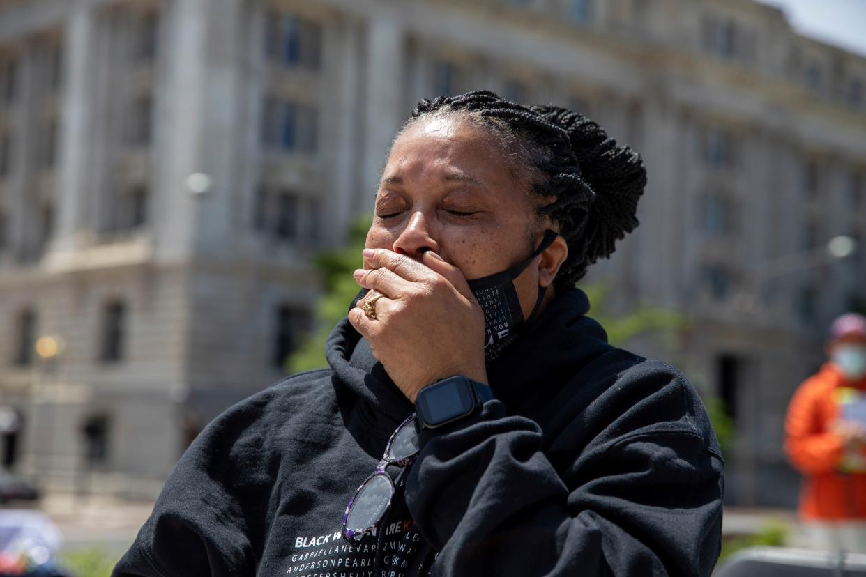 Rhanda Dormeus holds back tears at the Hear Our Cry rally at Freedom Plaza in Washington, on Thursday, May 6. Dormeus' daughter Korryn Gaines was killed by Baltimore police officers in 2016. 