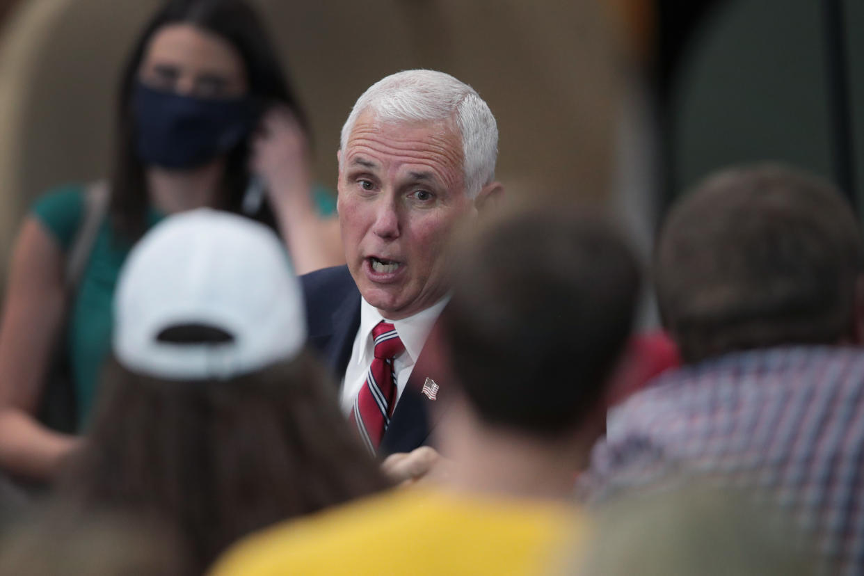 U.S. Vice President Mike Pence greets workers at Tankcraft Corporation on August 19, 2020 in Darien, Wisconsin. The visit comes a day after President Donald Trump’s son Eric visited the state and two days after the president visited the state. (Scott Olson/Getty Images) 