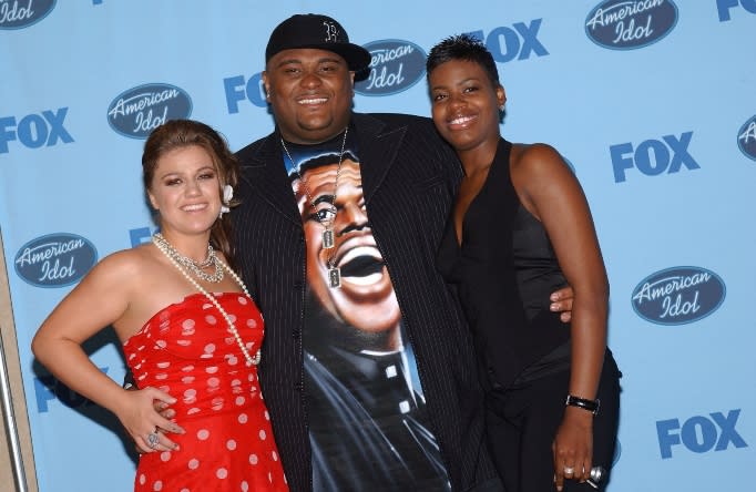 Fantasia Barrino, 19, right, of High Point, North Carolina, poses with previous winners Kelly Clarkson, left, and Ruben Studdard, after she won the 2004 "American Idol" final at the Kodak Theatre in Los Angeles, California, May 26, 2004.