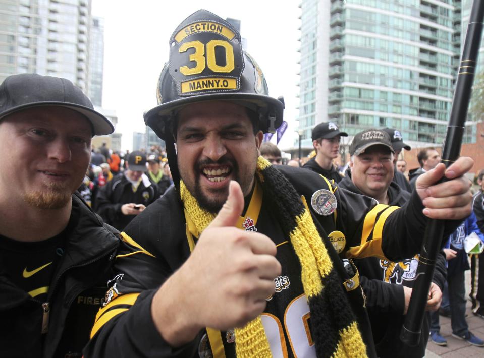A Hamilton Tiger Cats fan supports his team before the CFL eastern final football game against the Toronto Argonauts in Toronto, November 17, 2013. REUTERS/Fred Thornhill (CANADA - Tags: SPORT FOOTBALL)