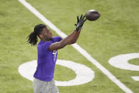 LSU wide receiver Brian Thomas Jr. catches a pass during LSU's NCAA football pro day in Baton Rouge, La., Wednesday, March 27, 2024. (AP Photo/Gerald Herbert)