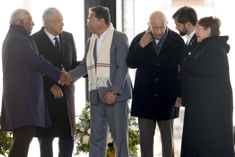 Leaders, from left, Portugal's Prime Minister Antonio Costa, Mexico's President Andres Manuel Lopez Obrador, Bolivia's President Luis Arce, former Chilean President Ricardo Lagos, current Chilean President Gabriel Boric and former Chilean President Michelle Bachelet, stand on the stage during a ceremony marking the 50th anniversary of the 1973 military coup that toppled the government of late President Salvador Allende, at La Moneda presidential palace in Santiago, Chile, Monday, Sept. 11, 2023. (AP Photo/Esteban Felix)