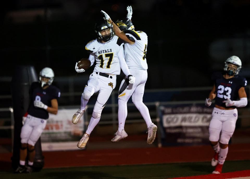 Roy’s Rhett Slater and teammate Robert Young celebrate after a touchdown as Woods Cross and Roy play at Woods Cross High School on Friday, Sept. 22, 2023. | Scott G Winterton, Deseret News