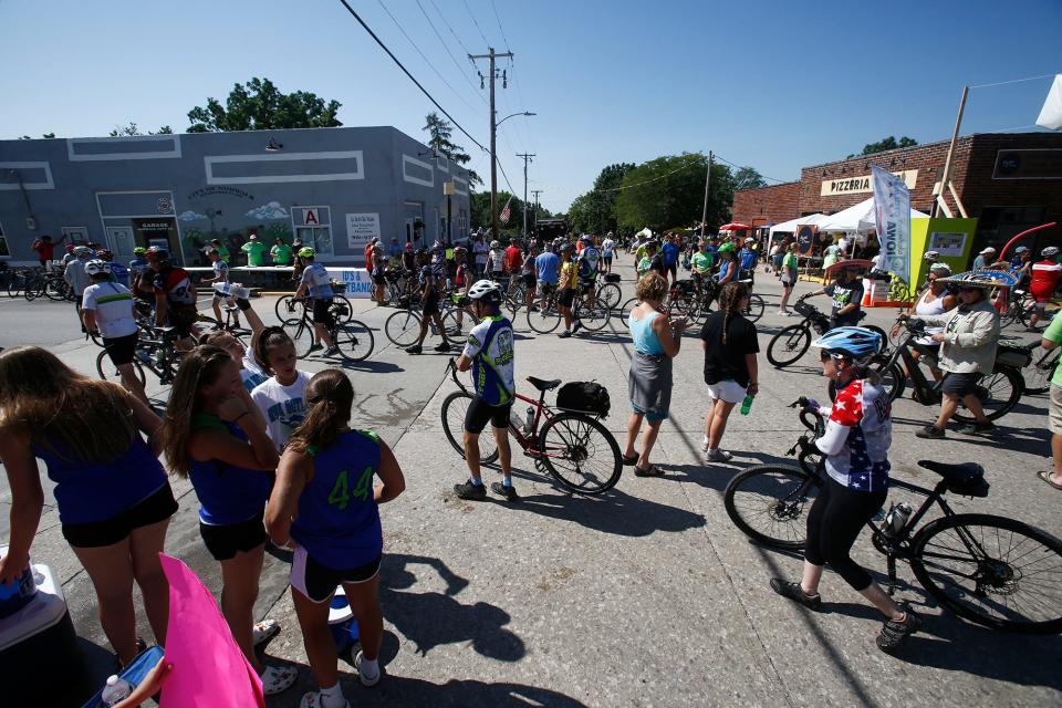 Riders pedal and walk into Norwalk on their way from Winterset in 2019.