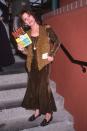 <p>Carrie Fisher holding a copy of her book <em>Delusions of Grandma</em>, published in 1993.</p>