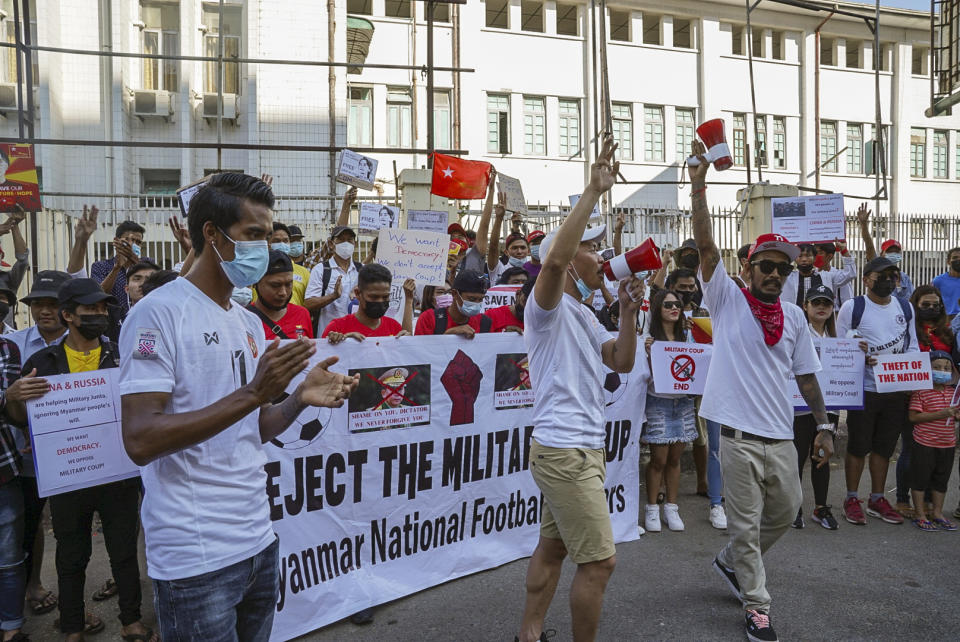 Members of the Myanmar national football team take turns in addressing their fans about their opposition to the military coup after holding a protest-related football match Saturday, Feb. 13, 2021 in Yangon, Myanmar. Fans in Myanmar of soccer teams belonging to England's Premier League have banded together to join the popular movement protesting the country's recent military takeover. Several senior players from Myanmar's national team similarly cast their lots with the protesters, announcing they will not represent the country under the military government.(AP Photo)