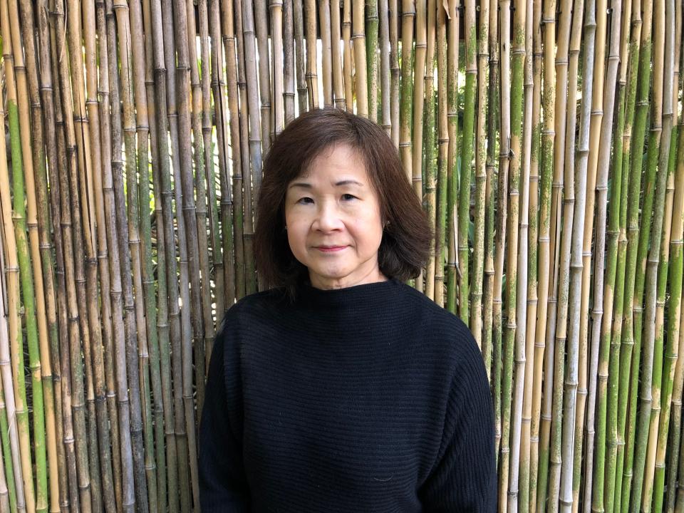 Yvonne Liu wearing a black sweater and looking at the camera