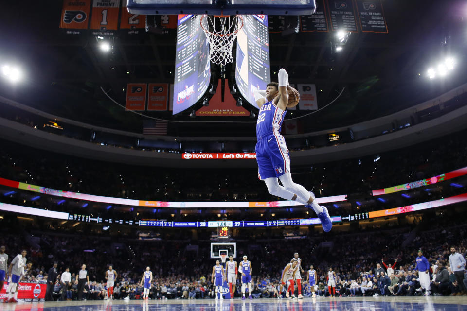 Philadelphia 76ers' Matisse Thybulle (22) goes up for a dunk during the first half of an NBA basketball game against the Detroit Pistons, Wednesday, March 11, 2020, in Philadelphia. (AP Photo/Matt Slocum)