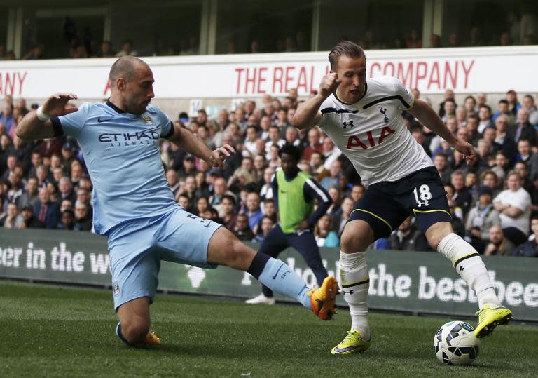 Manchester City's Argentinian defender Pablo Zabaleta (L) tackles Tottenham Hotspur's English striker Harry Kane during their English Premier League football match in London on May 3, 2015