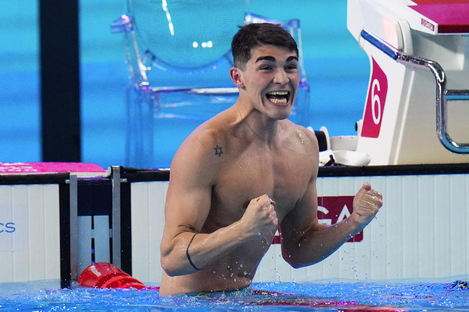 Diogo Matos Ribeiro of Portugal celebrates after winning in the men's 50m Butterfly Final at the World Aquatics Championships in Doha, Qatar, Monday, Feb. 12, 2024. (AP Photo/Hassan Ammar)