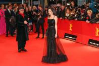 <p>At the 2016 Berlin International Film Festival, Amal graced the red carpet with a sparkling A-line black gown with a sheer overlay. Black accessories with a pop of red lipstick completed her shining look.</p>