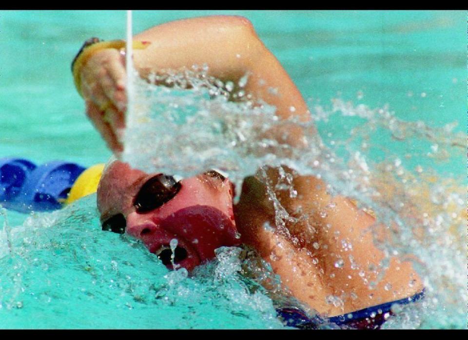 U.S. swimmer Jenny Thompson from Dover, N.H. practices with paddles 24 July 1992. Thompson is favored to win several gold medals during the women's individual events. 