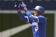 Toronto Blue Jays designated hitter George Springer motions to the dugout after hitting a double in the third inning of a baseball game against the Tampa Bay Rays in Toronto, Sunday, July 3, 2022. (Jon Blacker/The Canadian Press via AP)