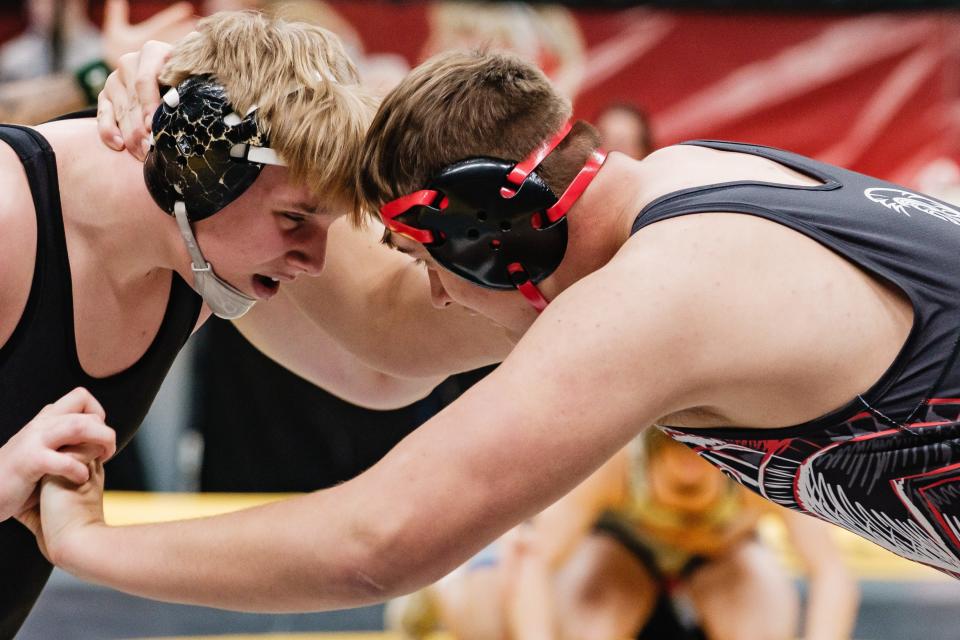 Dalton's Cohen Riggenbach, right, wrestles Tusky Valley's Dylan Congdon during day three of the Ohio High School Athletic Association 2024 State Wrestling Championships, Sunday, March 10 at The Ohio State University Jerome Schottenstein Center, in Columbus.