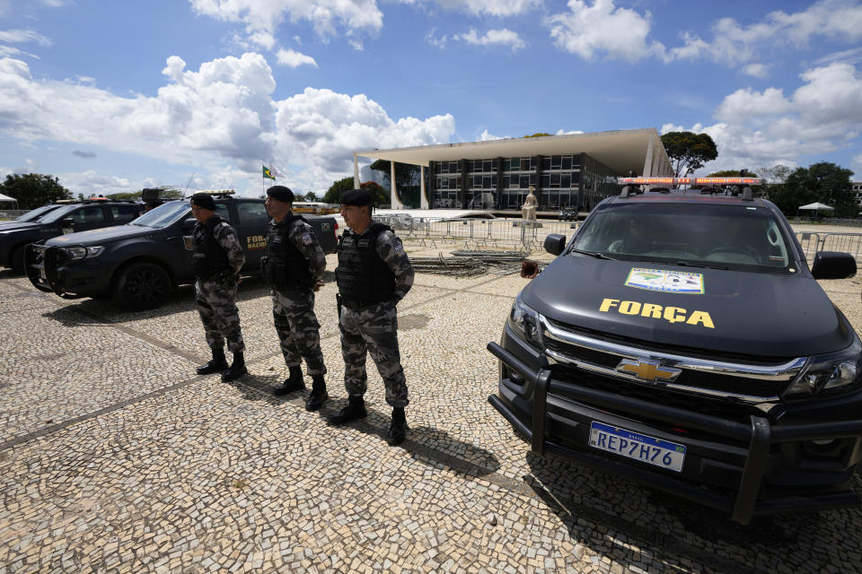 Military police stand guard outside the Supreme Court in Brasilia, Brazil, Wednesday, Jan. 11, 2023, ahead of expected protests called for by supporters of former Brazilian President Jair Bolsonaro. (AP Photo/Eraldo Peres)