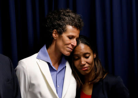 Bill Cosby accuser Andrea Constand embraces Special Prosecutor Kristen Gibbons Feden during a news conference after a jury convicted actor and comedian Bill Cosby for sexual assault during a retrial in Norristown, Pennsylvania, U.S., April 26, 2018. REUTERS/Brendan McDermid