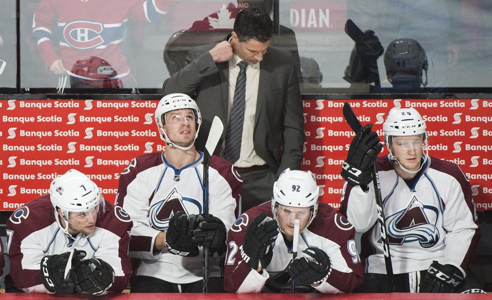 Colorado Avalanche head coach Jared Bednar looks down from behind the bench during the second period of an NHL hockey game in Montreal, Saturday, Dec. 10, 2016. (Graham Hughes/The Canadian Press via AP)