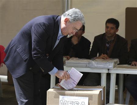 Former president of Colombia and candidate for the Senate Alvaro Uribe casts his vote during the congressional elections in Bogota March 9, 2014. REUTERS/John Vizcaino