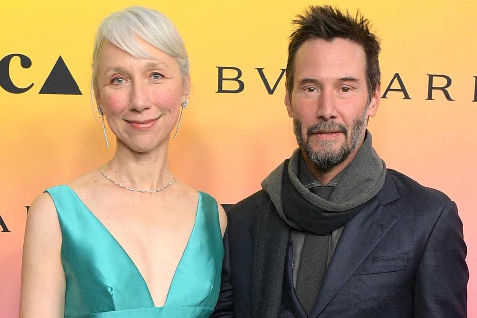 <p>Charley Gallay/Getty </p> Alexandra Grant (left) and Keanu Reeves