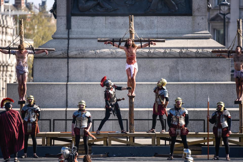 Actors reenact the crucifixion in front of crowds in Trafalgar Square on Good Friday. (Peter Summers via Getty Images)