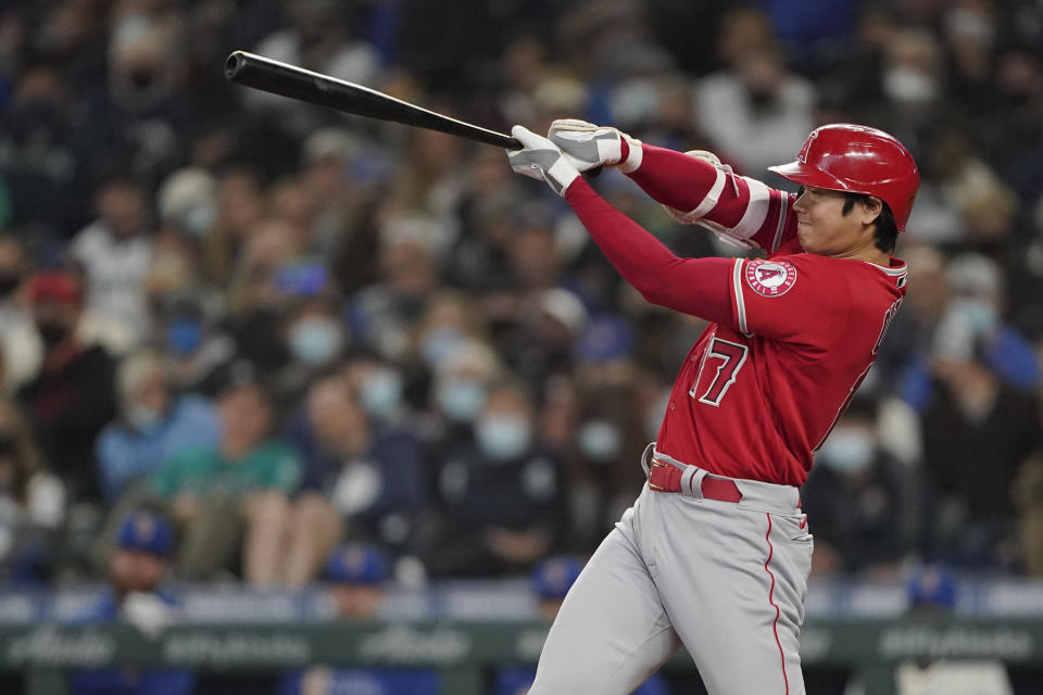 Los Angeles Angels' Shohei Ohtani strikes out swinging during the seventh inning of a baseball game against the Seattle Mariners, Sunday, Oct. 3, 2021, in Seattle. (AP Photo/Ted S. Warren)