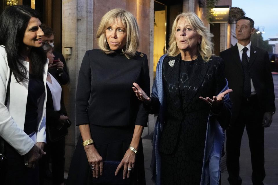 First lady Jill Biden, right, and French first lady Brigitte Macron, left, speak outside of a restaurant on the sidelines of an upcoming G20 summit in Rome, . A Group of 20 summit scheduled for this weekend in Rome is the first in-person gathering of leaders of the world's biggest economies since the COVID-19 pandemic started G20 Summit, Rome, Italy - 29 Oct 2021
