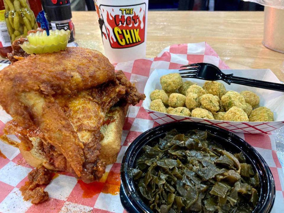 A fried chicken plate at The Hot Chik of a breast and a wing, Southern collard greens, fried okra, bread and pickles. The new restaurant has closed.