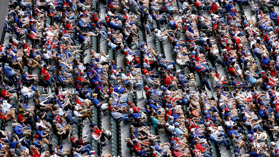 Fans, pictured here watching the Texas Rangers and Toronto Blue Jays.