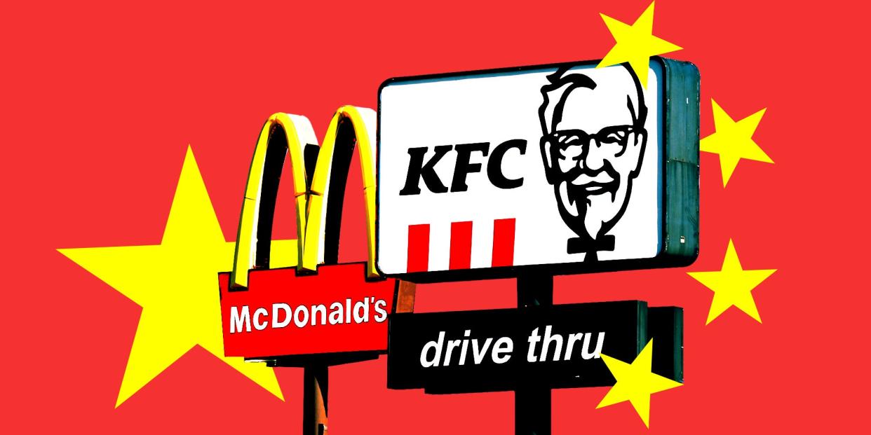 Pylon signs featuring the Golden Arches logo of McDonald's and the KFC logo, with stars reminiscent of China's flag on a red background