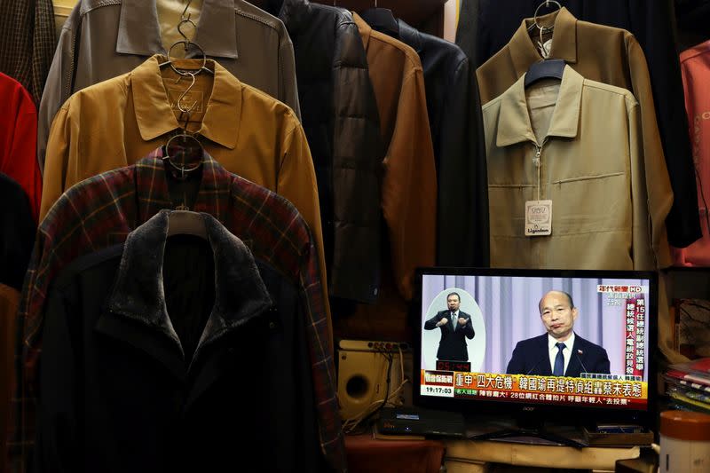 Nationalist Kuomintang Party (KMT) candidate Han Kuo-yu is seen on a TV screen during the third live policy address ahead of January's election, in Tainan