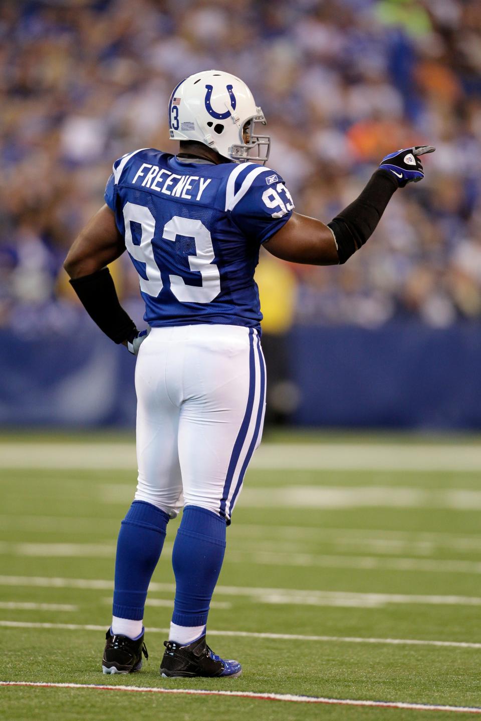 Indianapolis Colts defensive end Dwight Freeney points to the Cleveland Browns offense in the second quarter of an NFL football game in Indianapolis, Sunday, Sept. 18, 2011. (AP Photo/Darron Cummings)