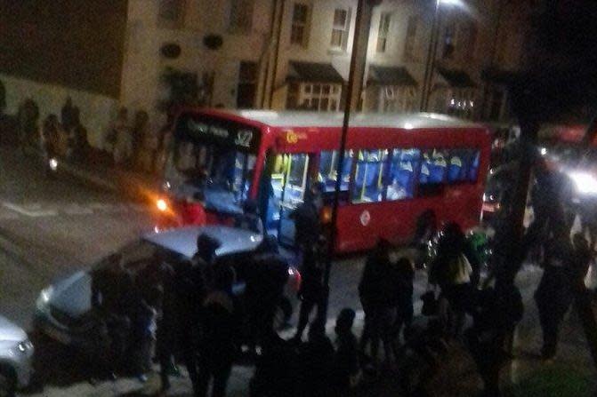 Revellers blockade a bus outside the rave in West Norwood: Trudi Brown (Twitter)