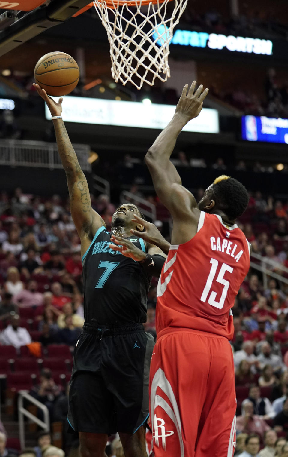 Charlotte Hornets' Dwayne Bacon (7) shoots as Houston Rockets' Clint Capela (15) defends during the first half of an NBA basketball game Monday, March 11, 2019, in Houston. (AP Photo/David J. Phillip)