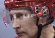 Russia's President Vladimir Putin takes part in a friendly ice hockey match in the Bolshoi Ice Palace near Sochi January 4, 2014. REUTERS/Alexei Nikolskiy/RIA Novosti/Kremlin