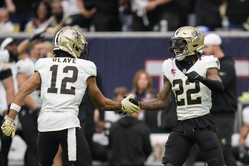 New Orleans Saints wide receiver Rashid Shaheed (22) celebrates his long pass reception with wide receiver Chris Olave (12) in the second half of an NFL football game against the Houston Texans in Houston, Sunday, Oct. 15, 2023. (AP Photo/Eric Christian Smith)