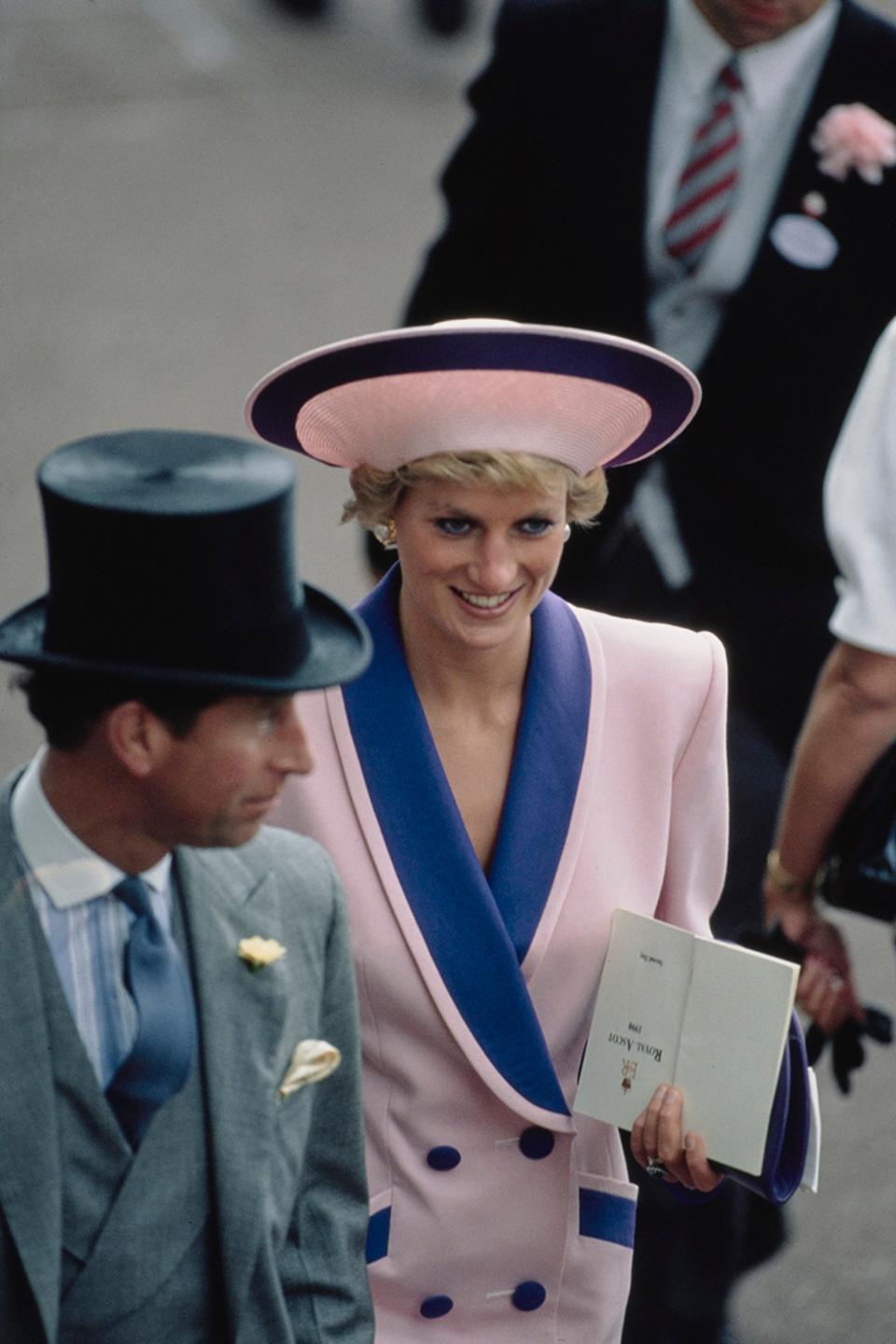 Prince Charles and Diana, Princess of Wales (1961 - 1997) on the second day of the Royal Ascot race meeting, UK, June 1990. Diana is wearing a pink and blue suit by Catherine Walker. (Photo by Jayne Fincher/Princess Diana Archive/Getty Images)