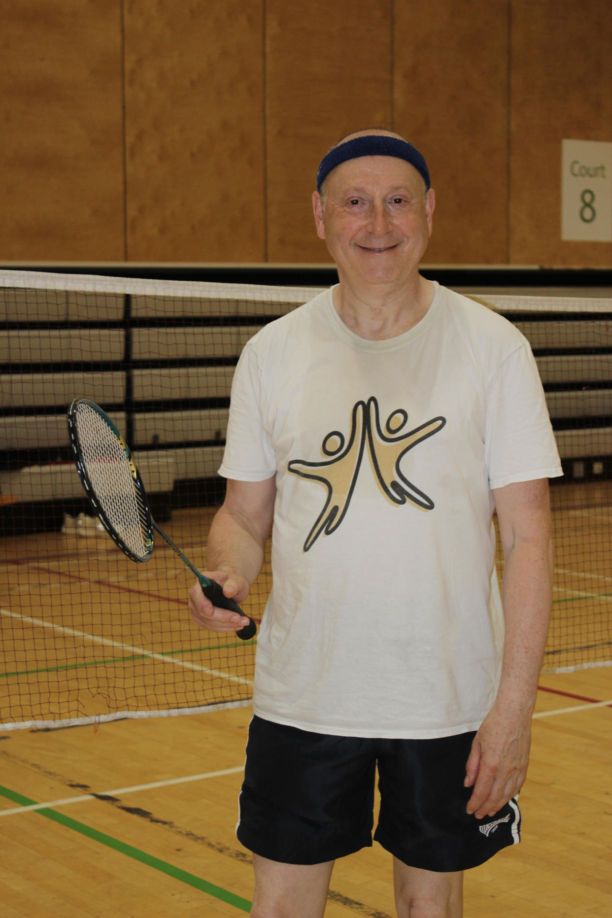 Man posing with racket