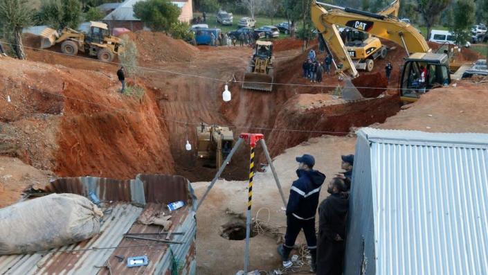 Heavy machinery attempting to rescue to the boy from the well