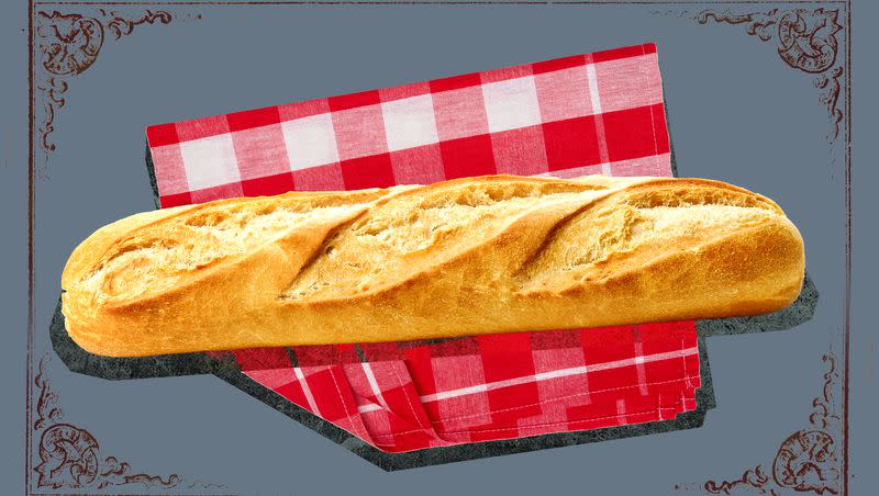 A loaf of baked bread on a red gingham check cloth with a gray background.