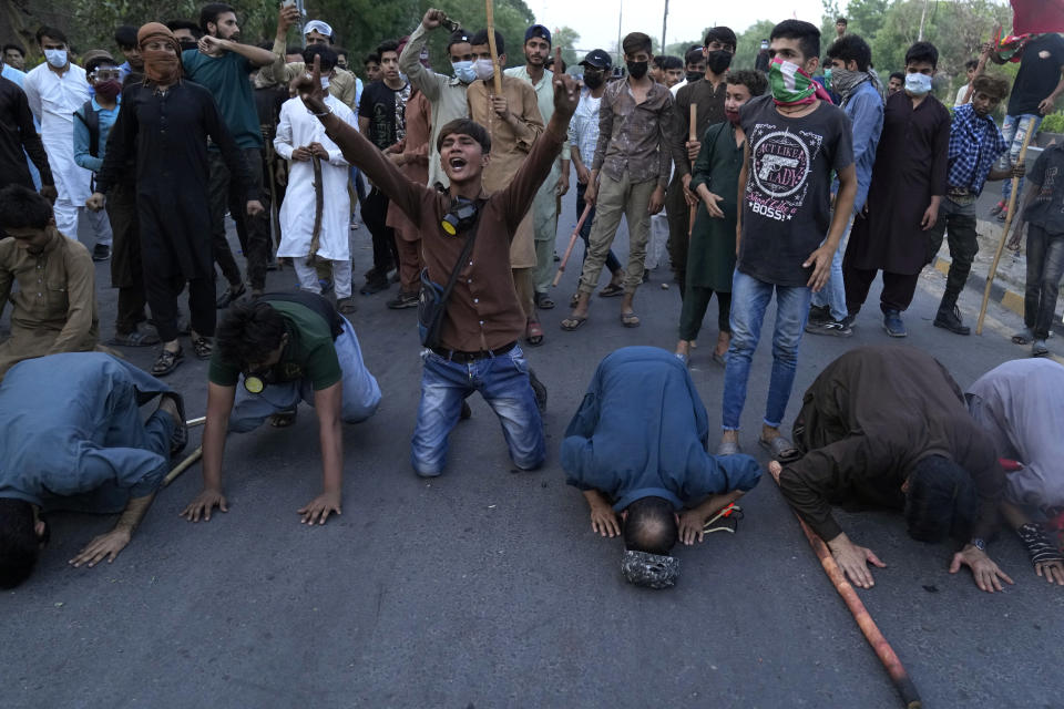 Supporters of Pakistan's former Prime Minister Imran Khan celebrate after Supreme Court decision, in Lahore, Pakistan, Thursday, May 11, 2023. Pakistan's Supreme Court on Thursday ordered the release of Khan, whose arrest earlier this week sparked a wave of violence across the country by his supporters. (AP Photo/K.M. Chaudary)