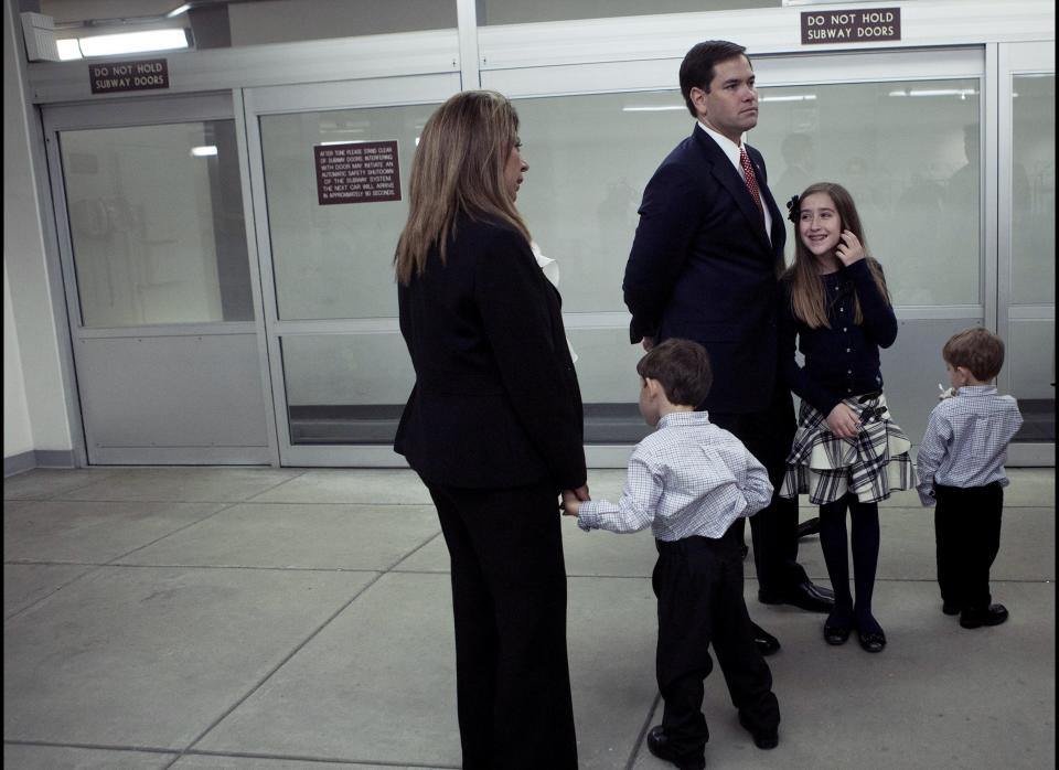 WASHINGTON - JANUARY 5:  Senator Marco Rubio (R-FL) waits with his mother-in-law Maria Elena Fleites (L), son Anthony (2L), daughter Amanda (2R) and son Domonick (R) for the Senate Subway after a ceremonial swearing-in in the Old Senate Chamber of Capitol Hill January 5, 2011 in Washington, DC.  Returning Senators and freshman were sworn in today as the 112th Congress began its session after the 2010 midterm elections.  (Photo by Brendan Smialowski/Getty Images)
