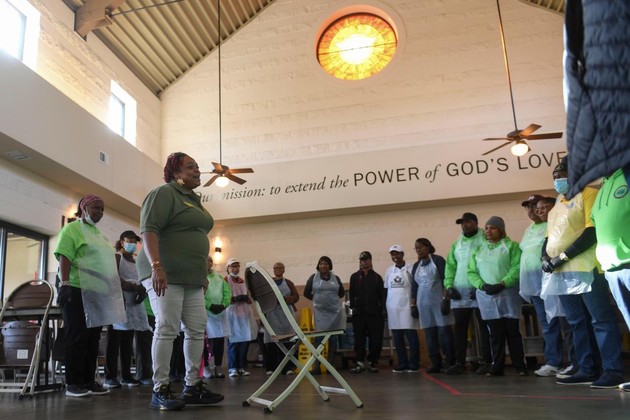 Volunteers are given instructions during the second annual MLK Day of Service at The Master's Table on Monday, Jan. 15, 2024. Golden Harvest Food Bank prepared to serve about 300 lunches, in addition to medical screenings by Augusta University students, and showers through Project Refresh.